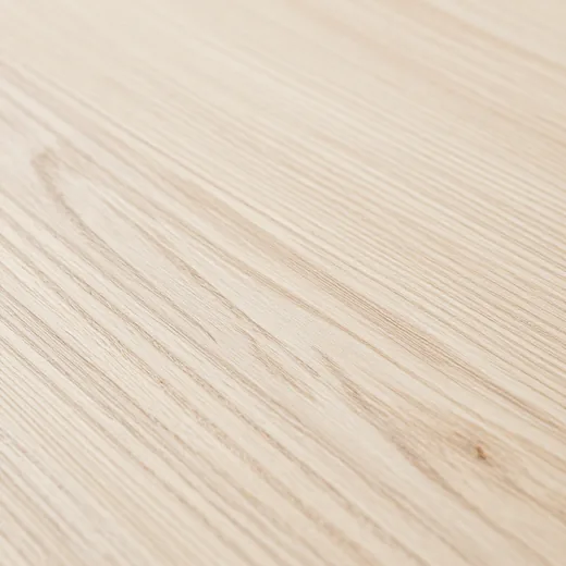 Close-up of rift-sawn white oak grain, unfinished pale timber.