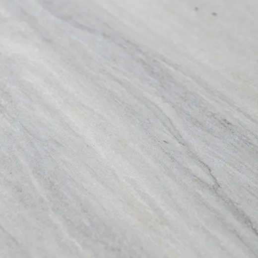 Close-up of a honed grey Bardiglio marble slab with pale veining.
