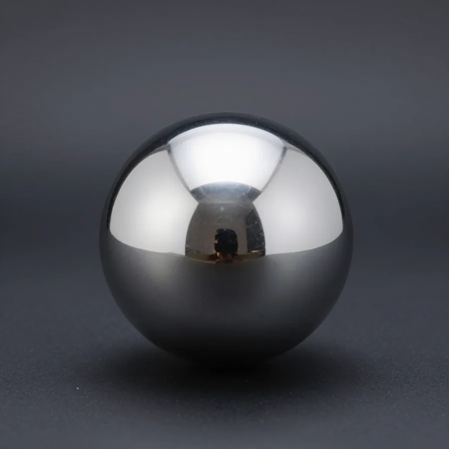 The M1 ORB photographed square on: a seamless mirror-chrome sphere with one soft highlight band across the top
